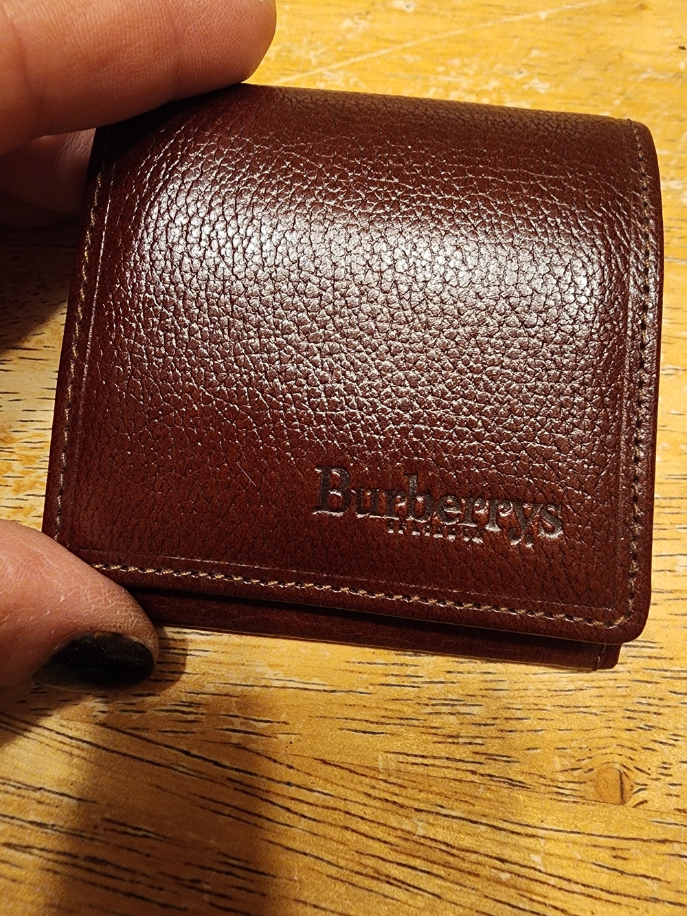 vintage brown pebbled leather coin purse featuring the debossed "Burberrys" logo
